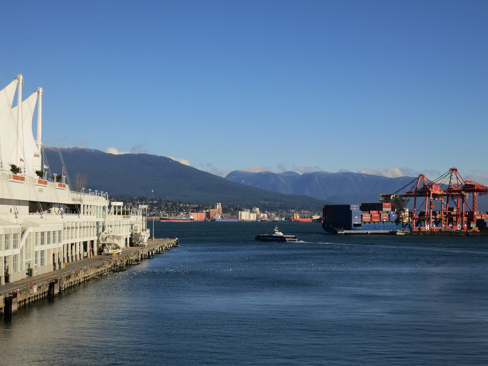 Canada Place, a SeaBus, and the port — summer on the pier.