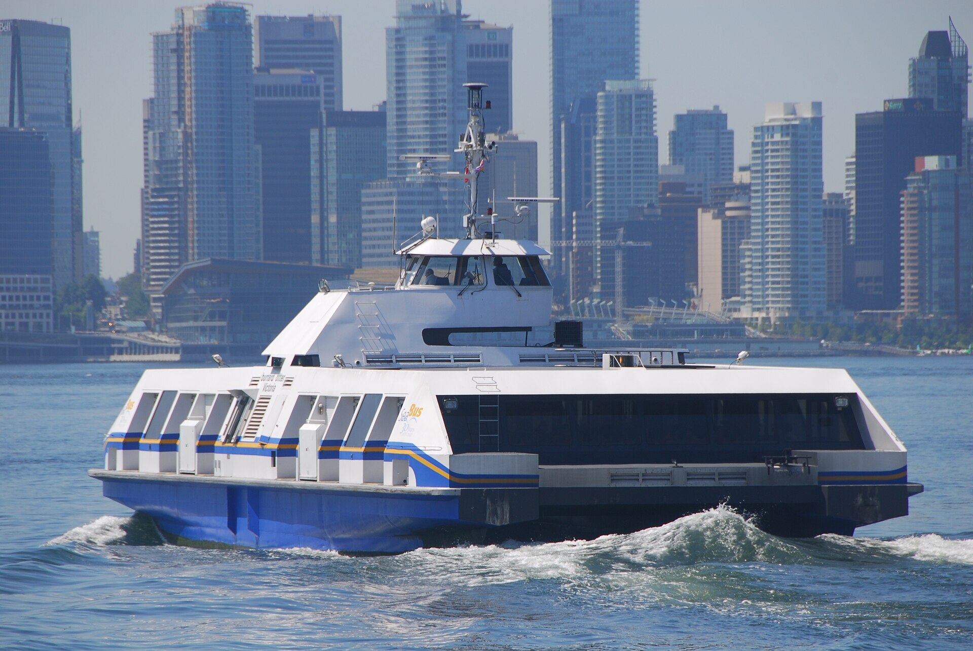 A SeaBus crossing toward the Vancouver skyline — the real harbour you just “flew” over.